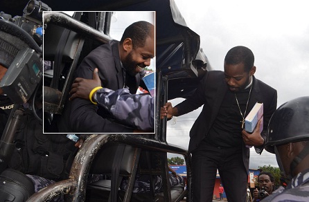 Pastor Ngabo being led to a police truck after the arrest