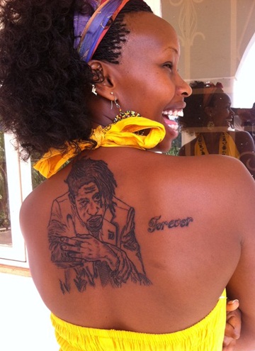 Barbie displaying Bobi Wine's tattoo on her back