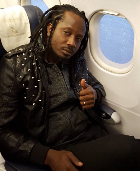 Bebe Cool aboard a South African Airways flight