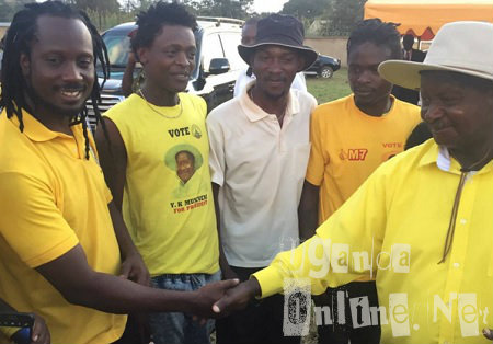 President Museveni shaking Bebe Cool's hand at one of the upcountry rallies