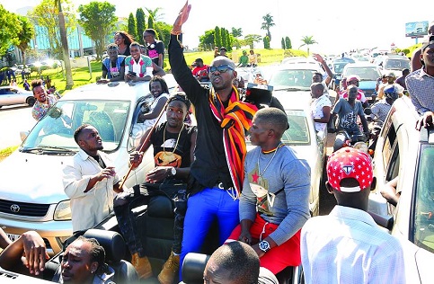 Eddy Kenzo and his fans on Entebbe -Kla highway