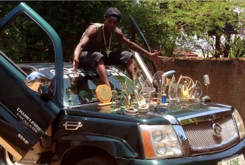 Chameleone showing off his awards
