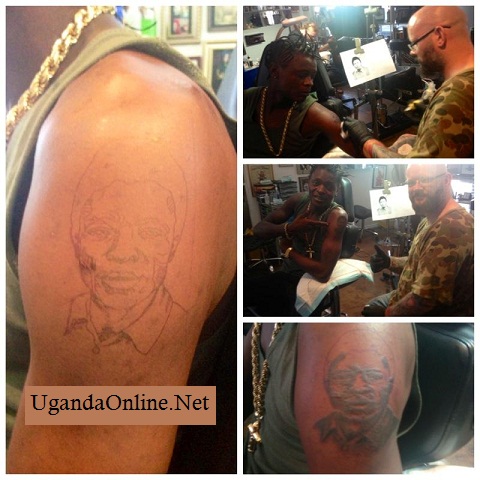 Chameleone showing off his Dad tattoo
