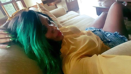Desire Showing off her green nails and hair