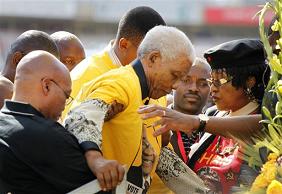South African Icon Nelson Mandela is being helped up the stage on 19 Apr 2009.